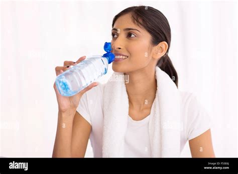 Attractive Indian Woman Drinking Water After Exercise Stock Photo Alamy