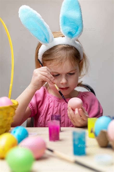 Little Girl In Easter Bunny Ears Painting Easter Eggs Holiday Crafts
