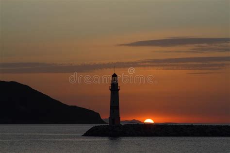 Seascape At Sunset Lighthouse On The Coast Seaside Town Of Turgutreis