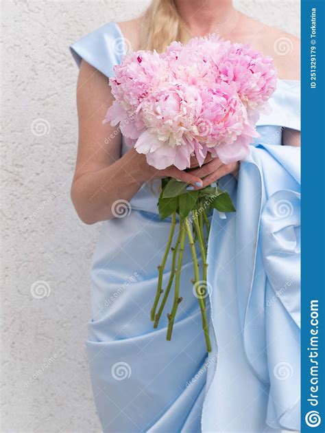 Bride In A Blue Wedding Dress With A Bouquet Of Pink Peonies Pastel