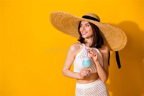 Photo Of Cheerful Dreamy Girl Dressed Knitted Look Sunhat Drinking Blue Beverage Empty Space