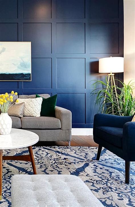 A Navy Blue Accent Wall With A Custom Grid Millwork Detail Brings
