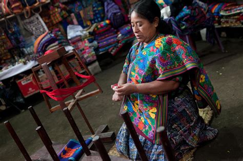 Traditional Guatemalan Clothing Demonstration In Antigua Choosing Figs