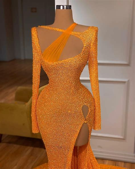 This Beautiful Orange Vandrin Sahiti Gown Is The Perfect Gown To Bring