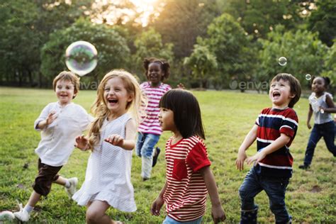 Group Of Diverse Kids Playing At The Field Together Stock Photo By Rawpixel