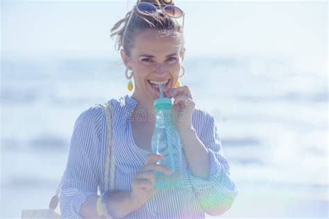 Portrait Of Smiling Stylish Woman With Drink At Beach Stock Image Image Of Beach Europe