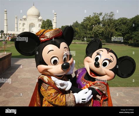 Mickey Mouse And Minnie Mouse Pose At The Taj Mahal In Agra India The