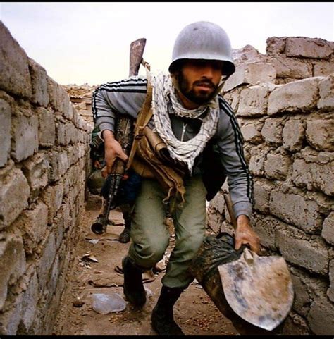 An Iranian Soldier Moving Through A Trench During The Iran Iraq War Mid