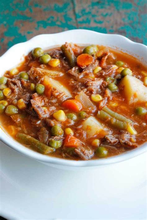 Made with whole ingredients, this homemade vegetable beef soup recipe is like a hug in a pot. My Mom's Old-Fashioned Vegetable Beef Soup - Smile Sandwich