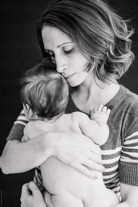 Black And White Portrait Of A Mother Bonding With Naked Newborn Son