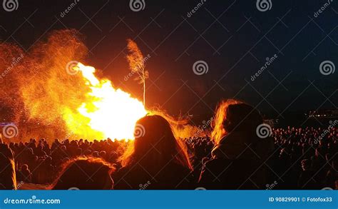 Easter Bonfire With People Outdoors Standing Next To Fire Stock Image