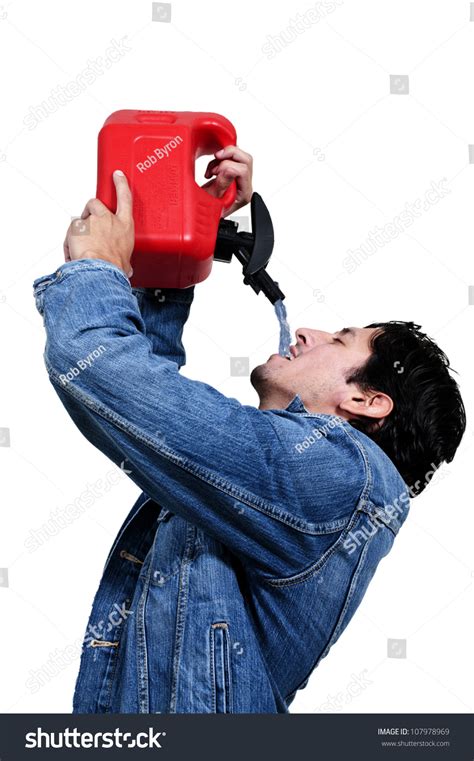 Handsome Man Drinking From A Gasoline Petrol Can Container Stock Photo