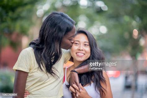 Interracial Lesbian Kissing Photos And Premium High Res Pictures