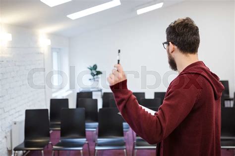 Speaker Standing In White Conference Room Backside Stock Image