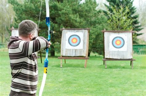 Archer Aiming With Bow Stock Photo By ©kalinovsky 5743500