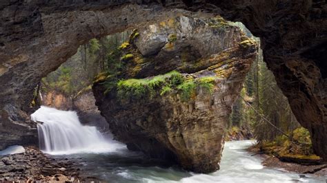 Cave And Waterfall Johnston Canyon Banff National Park Alberta