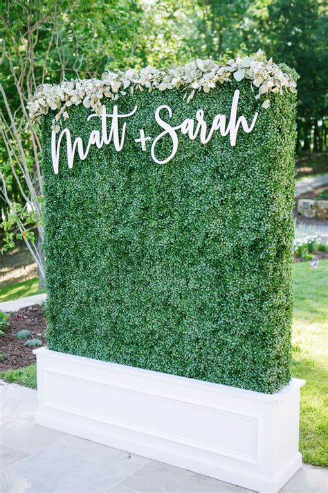 Boxwood Wall With Florals And Names Boxwood Backdrop Outdoor Wedding