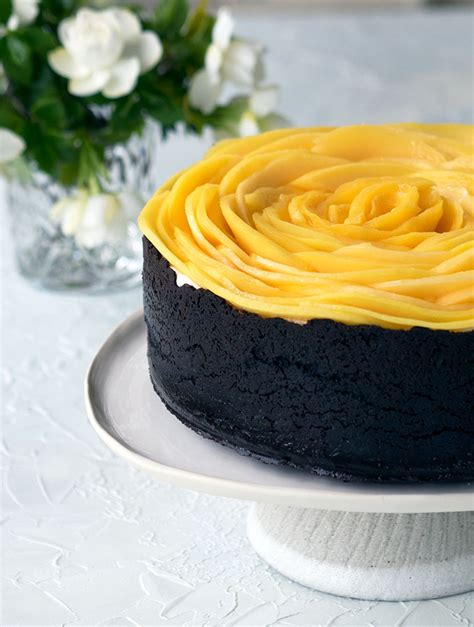 Sprinkle the white chocolate chunks evenly over the filling; Baked White Chocolate and Mango Cheesecake | Belly Rumbles