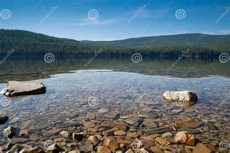Rocky Area Beach Of The Thompson Chain Of Lakes Area In Montana Stock