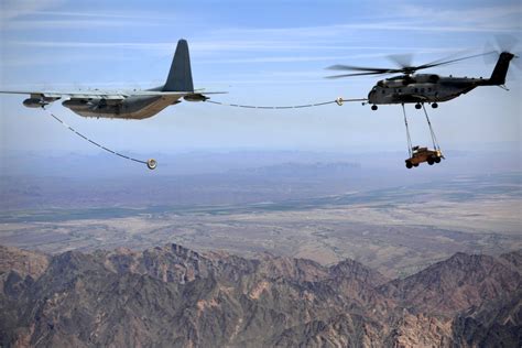A Marine Ch 53e Super Stallion Helicopter Conducts Aerial Refueling
