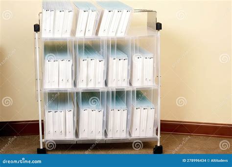 Vertical Filing System With Clear Plastic Folders And Labeled Tabs For