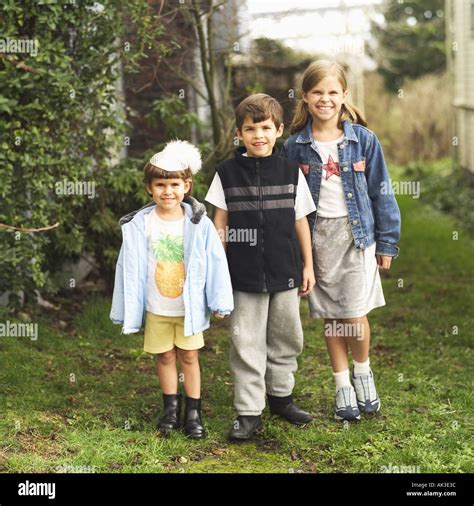Portrait Of Three Young Siblings Outdoors Stock Photo Alamy