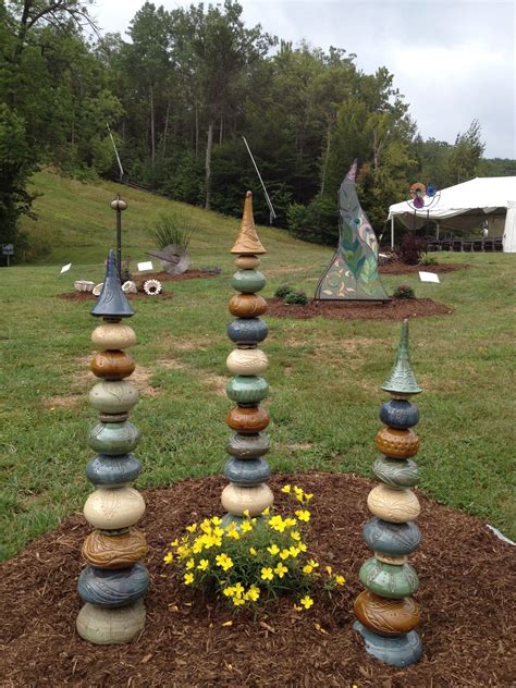 Three Large Totems On Display In A Sculpture Garden At Mt Sunapee Nh Garden Totems Glass