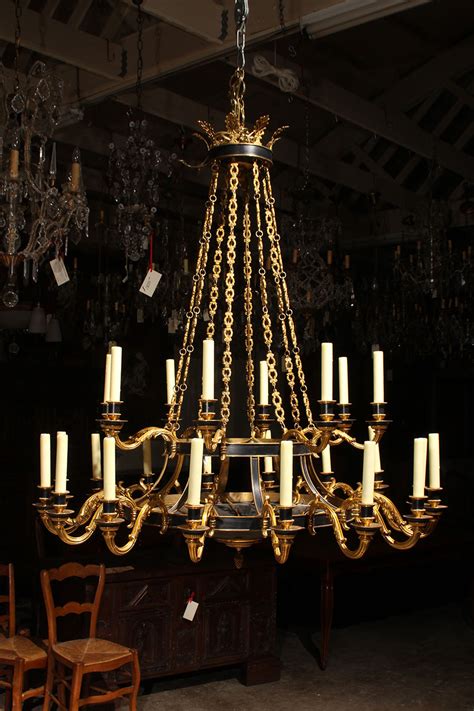Our french chandeliers are universally acclaimed. Bronze French Empire style chandelier with 24 lights.