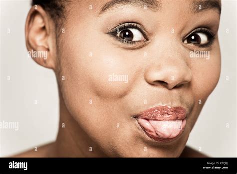 Woman Sticking Out Tongue Pulling Hi Res Stock Photography And Images