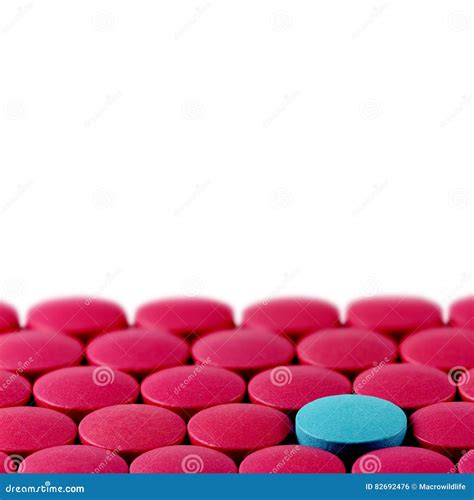 Blue Pill between Red Pills on White Background Stock Photo - Image of