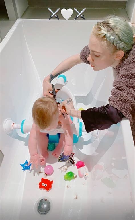 Grimes gives baby X AE A-XII his first haircut