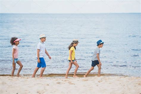 Multicultural Kids Walking On Beach — Stock Photo © Alebloshka 160970464