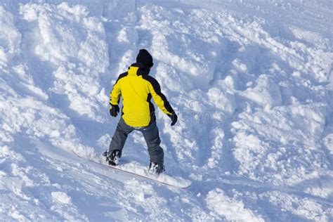 A Man Snowboarding A Mountain In The Snow In Winter Stock Image Image