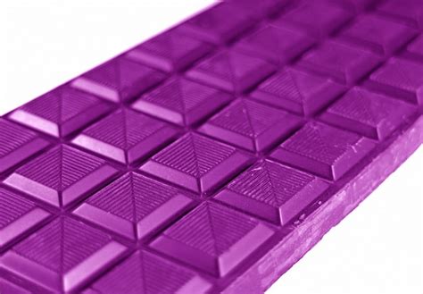 Closed Up Chocolate Bar In Vivid Purple Color Isolated On White