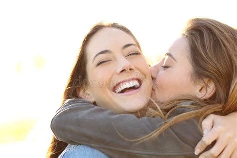 Woman Laughing Perfect Teeth Friend Kissing Her Stock Photos Free Royalty Free Stock Photos