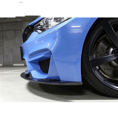 The aero lower centre diffuser is easy to fit and instantly adds an increased aesthetics appeal of the rear end of your vehicle. Carbon Fiber front diffuser front lip for BMW M4 F82