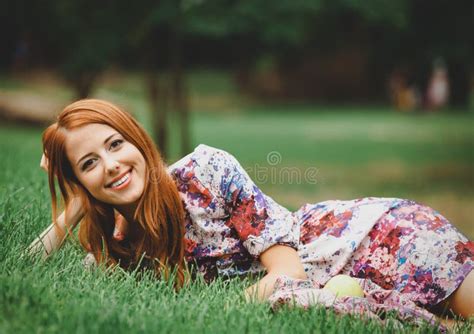 Redhead Girl With Apple On Green Lawn In A Park Stock Image Image Of Girl Green 131931775