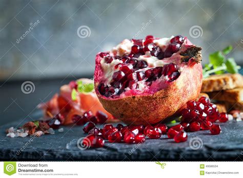 Sliced Prosciutto With Herbs And Pomegranate Seeds Stock Photo Image