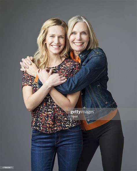 Mature Mother Hugging Daughter Portrait Photo Getty Images