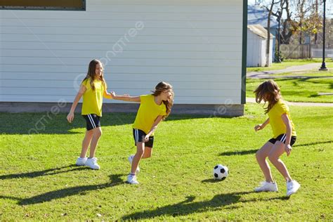 Friend Girls Teens Playing Football Soccer In A Park Turf Grass Photo