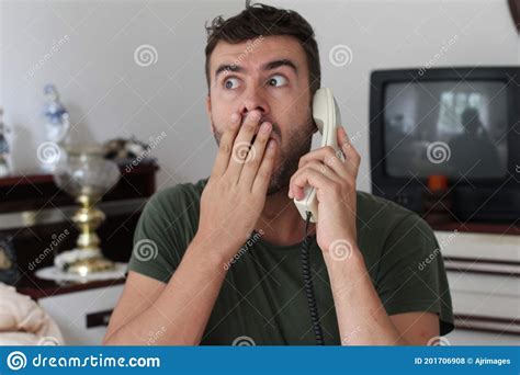 Man Getting Spooky News Through Landline Telephone Stock Photo Image