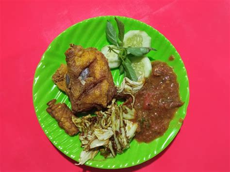 Pecel Ayam Fried Chicken With Sambal And Fresh Vegetables Stock Image