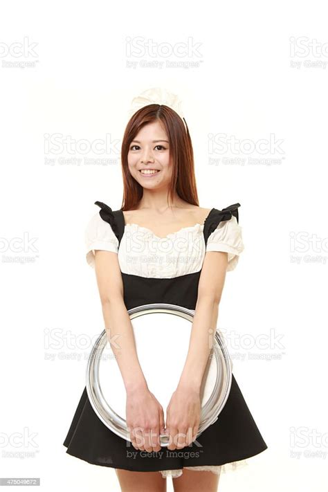 Young Japanese Woman Wearing French Maid Costume With Tray Stock Photo