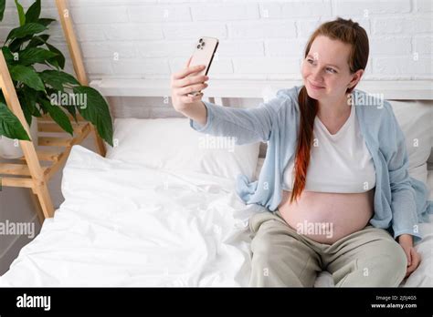 Beautiful Cheerful Pregnant Woman Taking Selfie Photo Using Mobile