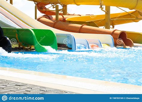 Different Colorful Slides In Water Park On Sunny Day Stock Image