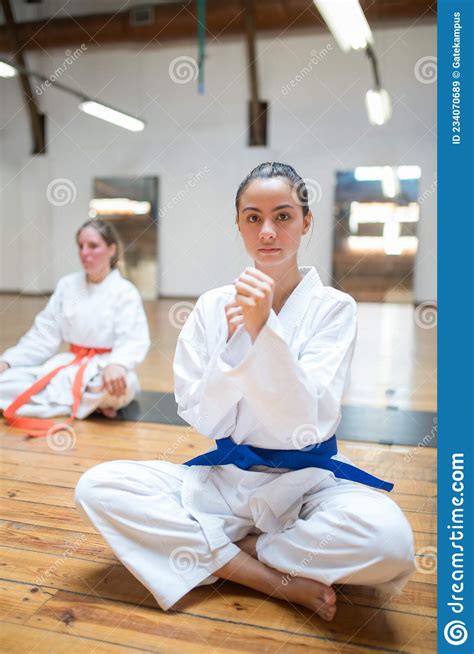 Slim Young Caucasian Karate Girl With Her Fists Up Ready For Class