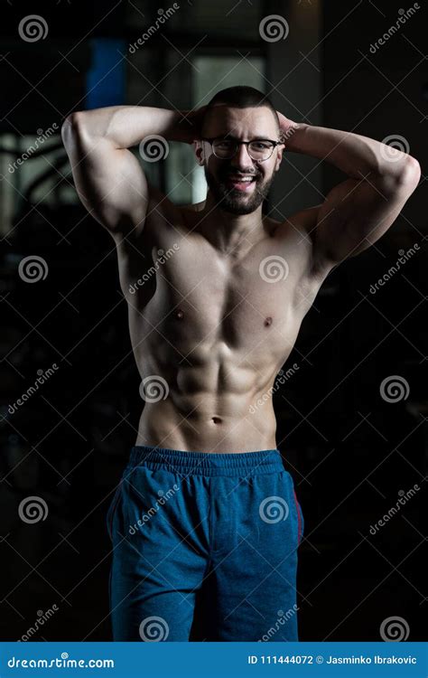 Nerd Man Standing Strong In Gym Stock Photo Image Of Eyeglasses Body