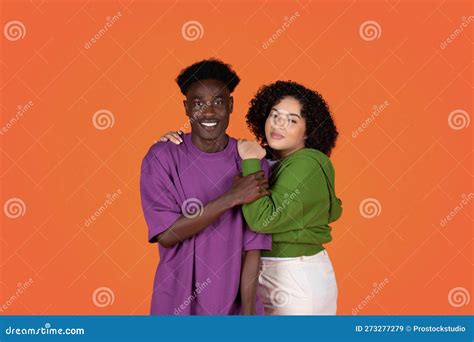 Loving Beautiful Mixed Race Couple Embracing Smiling At Camera Stock