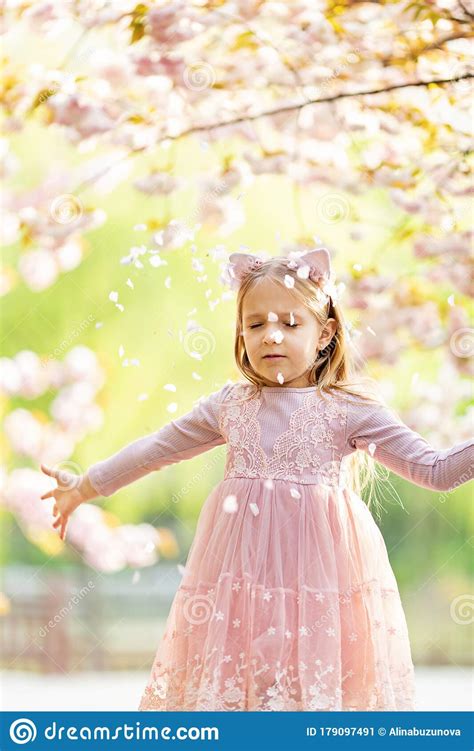Portrait Of Beautiful Girl With Blooming Flowers Cherry Blossom