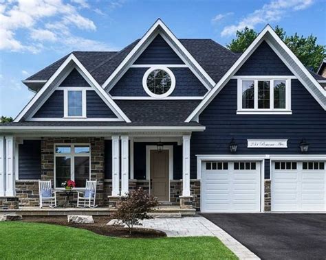 Stylish Blue House With White Trim And Garage
